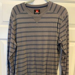 Men’s long sleeve quicksilver shirt in size large. Rarely worn.